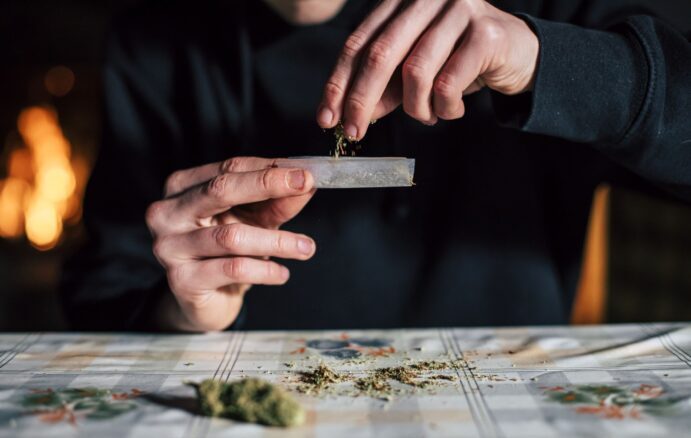 close-up-of-a-mans-hands-preparing-marihuana-joint