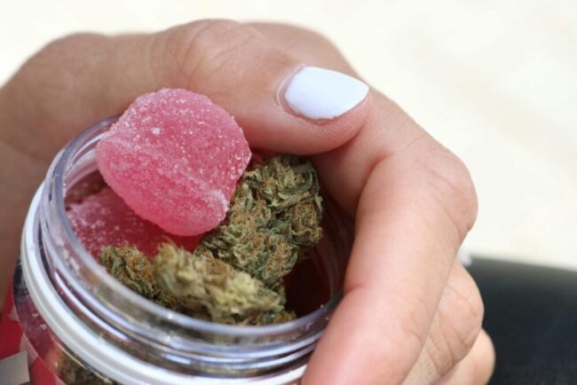Weed-Gummies-in-Girls-Hand-scaled